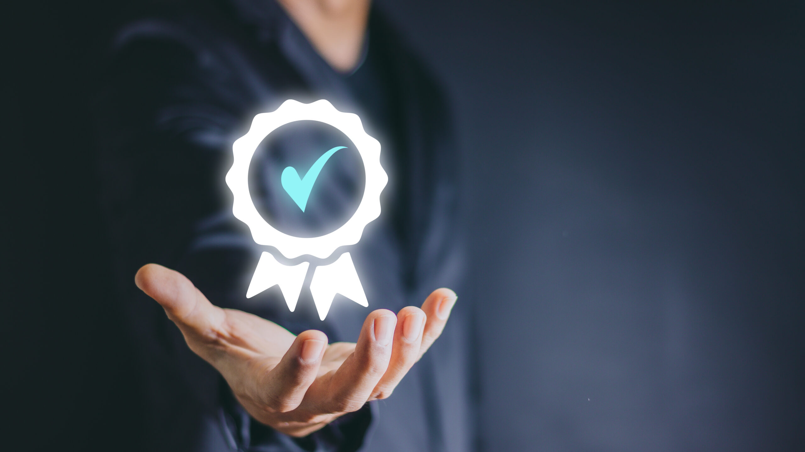 Hand shows the sign of the top service Quality assurance, Guaran